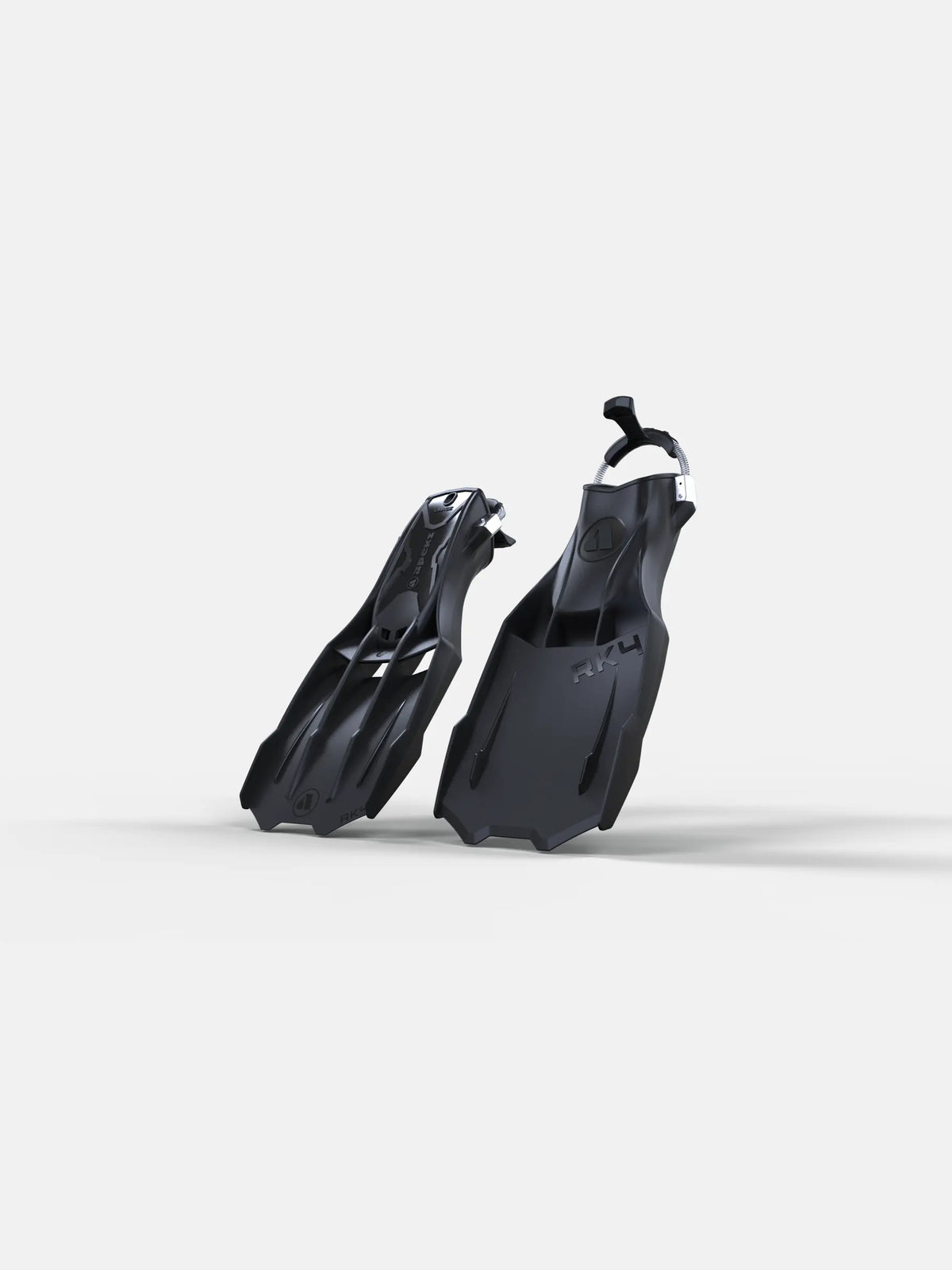 A pair of black Apeks RK4 dive fins with stainless-steel spring straps